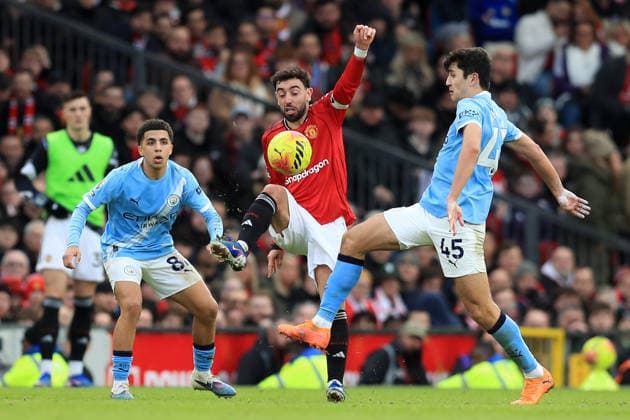 17th January 2026; Old Trafford, Manchester, England; Premier League Football, Manchester United, ManU versus Manchester City; Bruno Fernandes of Manchester United controls the ball under pressure from Abdukodir Khusanov of Manchester City  DavidxBlunsden