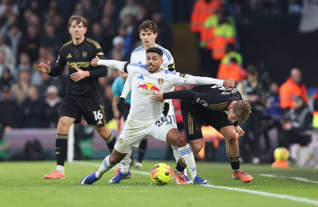 Leeds, England, 17th January 2026. James Justin (L) of Leeds United in action with Emile Smith Rowe of Fulham during the Leeds United vs Fulham Premier League match at Elland Road, Leeds. Picture credit should read: Nigel Roddis Sportimage EDITORIAL USE ONLY. No use with unauthorised audio, video, data, fixture lists, club league logos or live services. Online in-match use limited to 120 images, no video emulation. No use in betting, games or single club league player publications. SPI_020_NR_NEWC_FULH SPI-4457-0020