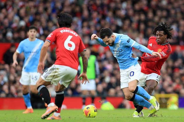 17th January 2026; Old Trafford, Manchester, England; Premier League Football, Manchester United, ManU versus Manchester City; Rayan Cherki of Manchester City is brought down by Matheus Cunha of Manchester United  DavidxBlunsden