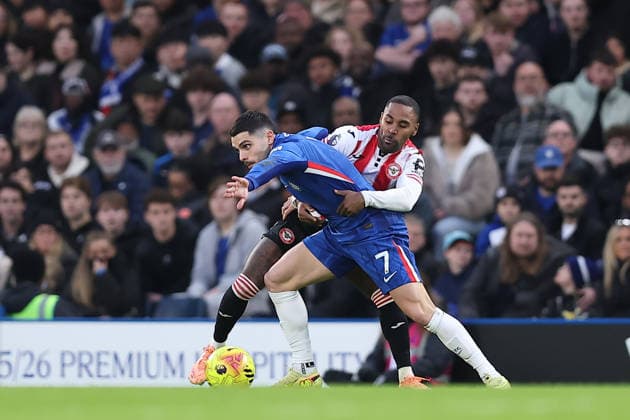 17th January 2026; Stamford Bridge, Chelsea, London, England: Premier League Football, Chelsea versus Brentford; Pedro Neto of Chelsea is held back by Rico Henry of Brentford  KatiexChan