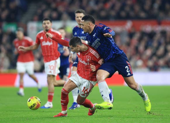 Nottingham, England, 17th January 2026. Nicolas Dominguez of Nottingham Forest attempts to get clear of William Saliba of Arsenal during the Nottingham Forest vs Arsenal Premier League match at the City Ground, Nottingham. Picture credit should read: Jessica Hornby Sportimage EDITORIAL USE ONLY. No use with unauthorised audio, video, data, fixture lists, club league logos or live services. Online in-match use limited to 120 images, no video emulation. No use in betting, games or single club league player publications. SPI_047_JH_FOREST_ARSENAL SPI-4459-0047