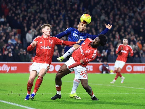 Nottingham, England, 17th January 2026. Elliot Anderson and Ola Aina of Nottingham Forest combine to keep out Gabriel Jesus of Arsenal during the Nottingham Forest vs Arsenal Premier League match at the City Ground, Nottingham. Picture credit should read: Jessica Hornby Sportimage EDITORIAL USE ONLY. No use with unauthorised audio, video, data, fixture lists, club league logos or live services. Online in-match use limited to 120 images, no video emulation. No use in betting, games or single club league player publications. SPI_061_JH_FOREST_ARSENAL SPI-4459-0061