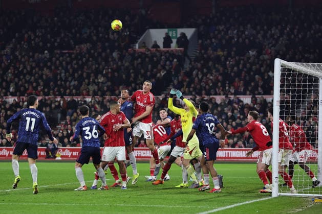NOTTINGHAM, ENGLAND - JANUARY 17: Players jostle for position at a corner during the Premier League match between Nottingham Forest and Arsenal at City Ground on January 17, 2026 in Nottingham, England. (Photo by James Holyoak) SPO 