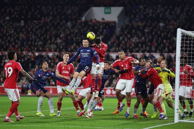 NOTTINGHAM, ENGLAND - JANUARY 17: Gabriel Martinelli of Arsenal and Neco Williams of Nottingham Forest vie for a header during the Premier League match between Nottingham Forest and Arsenal at City Ground on January 17, 2026 in Nottingham, England. (Photo by James Holyoak) SPO 