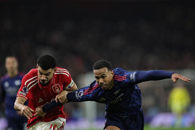 NOTTINGHAM, ENGLAND - JANUARY 17: Morgan Gibbs-White of Nottingham Forest and Gabriel of Arsenal battle for the ball during the Premier League match between Nottingham Forest and Arsenal at City Ground on January 17, 2026 in Nottingham, England. (Photo by James Holyoak) SPO 