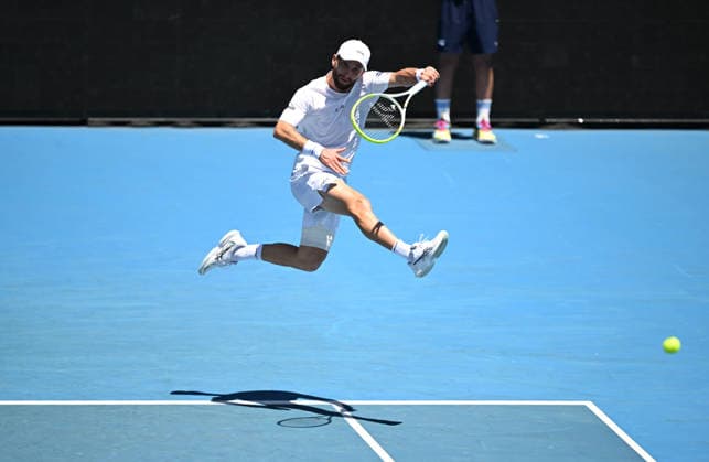 TENNIS AUSTRALIAN OPEN, Corentin Moutet of France in action during the Men™s 1st round match against Tristan Schoolkate of Australia on day 1 of the 2026 Australian Open tennis tournament at Melbourne Park in Melbourne, Wednesday, January 14, 2026. ( NO ARCHIVING MELBOURNE VICTORIA AUSTRALIA  Copyright: xLUKASxCOCHx 20260118131263290108