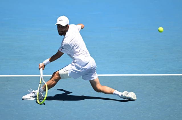 TENNIS AUSTRALIAN OPEN, Corentin Moutet of France in action during the Men™s 1st round match against Tristan Schoolkate of Australia on day 1 of the 2026 Australian Open tennis tournament at Melbourne Park in Melbourne, Wednesday, January 14, 2026. ( NO ARCHIVING MELBOURNE VICTORIA AUSTRALIA  Copyright: xLUKASxCOCHx 20260118132226559241