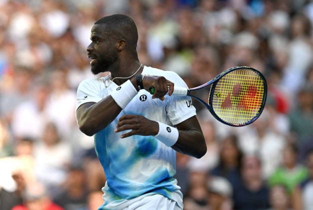 TENNIS AUSTRALIAN OPEN, Frances Tiafoe of USA in action uring the Men™s 1st round match against Jason Kubler of Australia on day 1 of the 2026 Australian Open tennis tournament at Melbourne Park in Melbourne, Wednesday, January 14, 2026. ( NO ARCHIVING MELBOURNE VICTORIA AUSTRALIA  Copyright: xLUKASxCOCHx 20260118125375799098