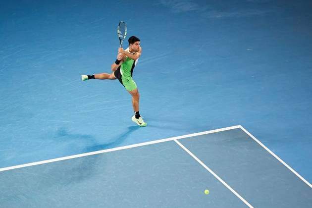Carlos Alcaraz of Spain hits a backhand Australian Open tennis tournament, Day One, Melbourne Park, Australia - 18 Jan 2026Melbourne Melbourne Park Victoria (VIC) Australia  Copyright: xRachelxBach Shutterstockx 16302999bt