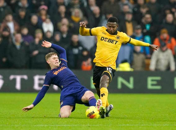 Wolverhampton, England, 18th January 2026. Yerson Mosquera of Wolverhampton Wanderers fouled by Lewis Hall during the Wolverhampton Wanderers vs Newcastle United Premier League match at Molineux, Wolverhampton. Picture credit should read: Andrew Yates Sportimage EDITORIAL USE ONLY. No use with unauthorised audio, video, data, fixture lists, club league logos or live services. Online in-match use limited to 120 images, no video emulation. No use in betting, games or single club league player publications. SPI_043_AY_Wolves_Newcastle SPI-4461-0042