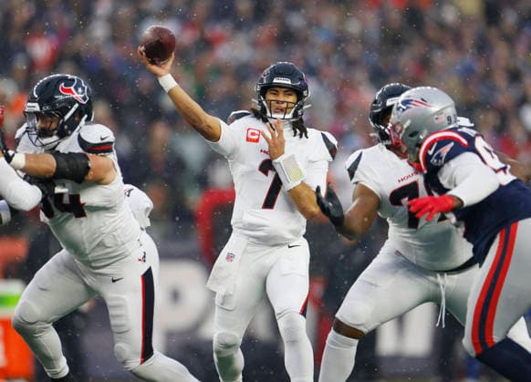 Houston quarterback C.J. Stroud (7) passes downfield against the New England Patriots in the second quarter of an NFL, American Football Herren, USA Divisional round playoff game at Gillette Stadium in Foxborough, Massachusetts, on Sunday, January 18, 2026.  FOX20260118824 CJxGUNTHER
