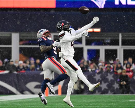 Jan 18, 2026; Foxborough, MA, USA; Houston Texans cornerback Kamari Lassiter (4) defends a pass to New England Patriots wide receiver Kayshon Boutte (9) during the first half of the AFC divisional playoff round at Gillette Stadium, in Foxborough, Massachusetts. CSM Foxborough USA - ZUMAc04_ 20260118_faf_c04_030 Copyright: xEricxCanhax