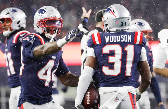 New England safety Craig Woodson (31) celebrates with safety Brenden Schooler (41) after recovering a fumble by Houston running back Woody Marks in the third quarter of an NFL, American Football Herren, USA Divisional round playoff game at Gillette Stadium in Foxborough, Massachusetts, on Sunday, January 18, 2026.  FOX20260118850 CJxGUNTHER