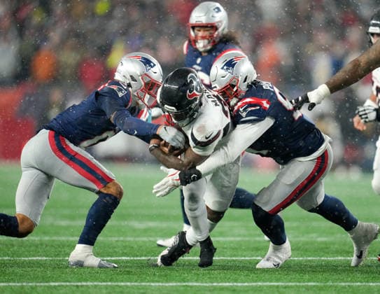 January 18, 2026, Foxboro, Massachusetts, USA: Patriots cornerback CHRISTIAN GONZALEZ (0) strips the ball from Texans running back WOODY MARKS (27) on a tackle during the second half of the NFL, American Football Herren, USA Divisional Round Playoff game between the New England Patriots and the Houston Texans on January 18, 2026 in Foxboro, Massachusetts. The Patriots won, 28-16. Foxboro USA - ZUMAc201 20260118_zap_c201_058 Copyright: xScottxColemanx