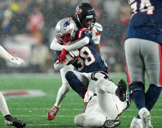 January 18, 2026, Foxboro, Massachusetts, USA: Patriots running back RHAMONDRE STEVENSON (38) is tackled during the second half of the NFL, American Football Herren, USA Divisional Round Playoff game between the New England Patriots and the Houston Texans on January 18, 2026 in Foxboro, Massachusetts. The Patriots won, 28-16. Foxboro USA - ZUMAc201 20260118_zap_c201_073 Copyright: xScottxColemanx