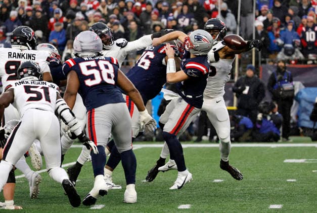 FOXBOROUGH, MA - JANUARY 18: Drake Maye 10 of the New England Patriots fumbles the ball after being hit during an AFC Divisional Round game between the New England Patriots and the Houston Texans on January 18, 2026, at Gillette Stadium in Foxborough, Massachusetts. (Photo by Fred Kfoury III Icon Sportswire) NFL, American Football Herren, USA JAN 18 AFC Divisional Round Texans at Patriots EDITORIAL USE ONLY Icon482260118018