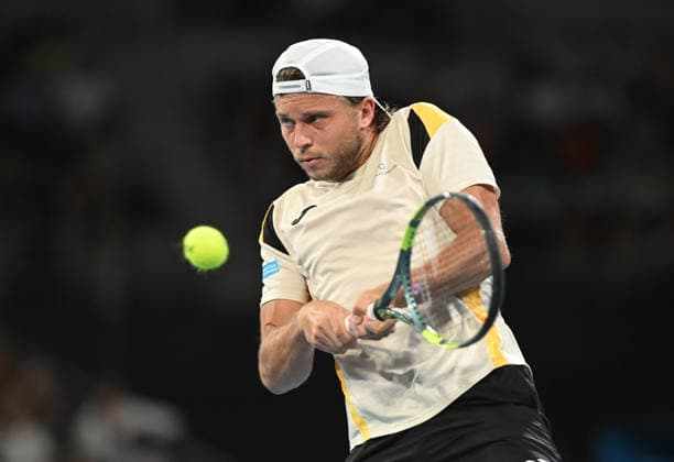 TENNIS AUSTRALIAN OPEN, Alexandre Muller of France in action during the Men™s 1st round match against Alexi Popyrin of Australia on day 2 of the 2026 Australian Open tennis tournament at Melbourne Park in Melbourne, Monday, January 19, 2026. ( NO ARCHIVING MELBOURNE VICTORIA AUSTRALIA  Copyright: xLUKASxCOCHx 20260119194982511585