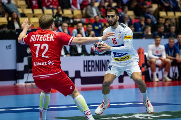 HERNING, DENMARK - JANUARY 19: Lukas Hutecek (Austria, 72) against Uros Kojadinovic (Serbia, 15) during the EHF EURO 2026 match between Austria vs Serbia at Jyske Bank Boxen Arena on matchday 3 of the Group Matches Group A on January 19, 2026 in Herning, Denmark. Midtjylland Denmark Copyright: xMarioxM.xKobergx