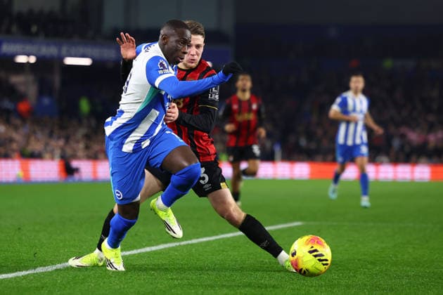 Brighton and Hove, England, 19th January 2026. Yankuba Minteh of Brighton and Hove Albion and Adrien Truffert of Bournemouth challenge for the ball during the Brighton and Hove Albion vs AFC Bournemouth Premier League match at the AMEX Stadium, Brighton and Hove. Picture credit should read: Paul Terry Sportimage EDITORIAL USE ONLY. No use with unauthorised audio, video, data, fixture lists, club league logos or live services. Online in-match use limited to 120 images, no video emulation. No use in betting, games or single club league player publications. SPI_049_PT_Brighton_Bournemouth SPI-4463-0049