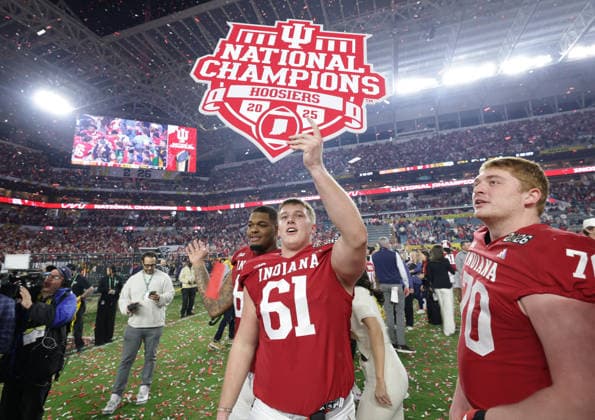Indiana offensive lineman Baylor Wilkin (61) celebrates after the Hoosiers defeated the Miami Hurricanes 27-21 in the NCAA, College League, USA College Football Championship game at Hard Rock Stadium in Miami, Florida, on Monday, January 19, 2026.  MIA20260119871 AARONxJOSEFCZYK