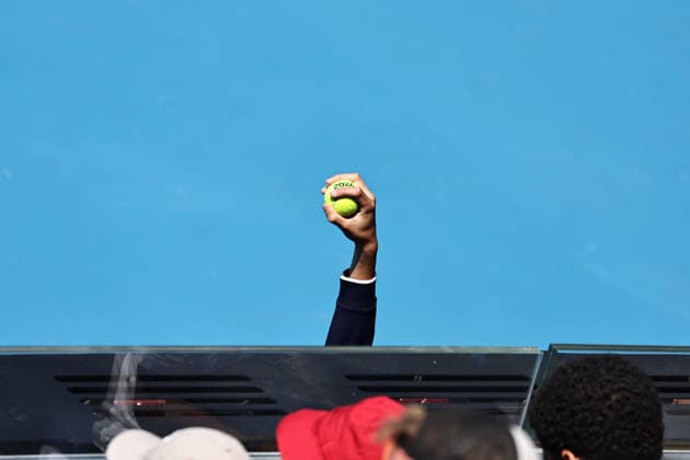 A ballgirl shows a ball during first round of 2026 Australian Open in Melbourne, 20 01 2026; -