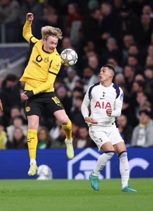 London, England, 20th January 2026. Julian Brandt of Borussia Dortmund and Pedro Porro of Tottenham during the Tottenham Hotspur vs Borussia Dortmund UEFA Champions League match at the Tottenham Hotspur Stadium, London. Picture credit should read: David Klein Sportimage EDITORIAL USE ONLY. No use with unauthorised audio, video, data, fixture lists, club league logos or live services. Online in-match use limited to 120 images, no video emulation. No use in betting, games or single club league player publications. SPI_048_DK_Spurs_Dortmund SPI-4464-0049