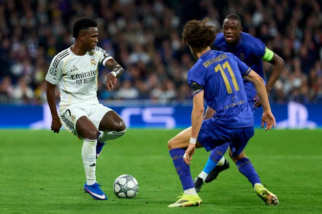 Vinicius Junior of Real Madrid CF battles for the ball with Maghnes Akliouche of AS Monaco FC during the UEFA Champions League match between Real Madrid CF and AS Monaco FC at Bernabeu stadium on January 20, 2026. - 20 01 2026 - Spain Madrid Madrid -  LGMx xLexPictorium LePictorium_0323270