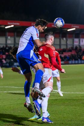 Salford City v Swindon Town - Emirates FA Cup Third Round Ryan Tafazolli of Swindon Town FC holds Ryan Graydon of Salford City FC to head the ball away during the Emirates FA Cup Third Round match between Salford City and Swindon Town at The Peninsula Stadium in Salford, England, on January 20, 2026. Salford Lancashire United Kingdom  Copyright: xMIxNewsx originalFilename:fletcher-salfordc260120_npaLW.jpg