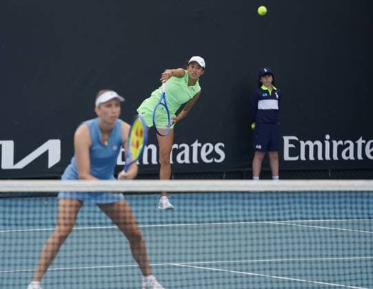 (260121) -- MELBOURNE, Jan. 21, 2026 -- Zhang Shuai (C) Elise Mertens (L) compete during the women s doubles 1st round match between Zhang Shuai (China) Elise Mertens (Belgium) and Sorana Cirstea (Romania) Anna Kalinskaya (Russia) at the Australian Open tennis tournament in Melbourne, Australia, Jan. 21, 2026. (Photo by Xinhua) (SP)AUSTRALIA-MELBOURNE-TENNIS-AUSTRALIAN OPEN-WOMEN S DOUBLES-DAY 4 WangxShen 