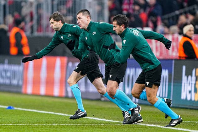 2026-01-21 FC Bayern München v R. Union Saint-Gilloise - UEFA Champions League 2025 26 League Phase MD7 MUNICH, GERMANY - JANUARY 21: assistant referee Jure Praprotnik, referee Rade Obrenovic, assistant referee Grega Kordez doing a warmup during the UEFA Champions League 2025 26 League Phase MD7 match between FC Bayern M++nchen and R. Union Saint-Gilloise at Football Arena Munich on January 21, 2026 in Munich, Germany. Munich Football Arena Munich Germany Content not available for redistribution in The Netherlands directly or indirectly through any third parties. Copyright: xAndrexWeeningx