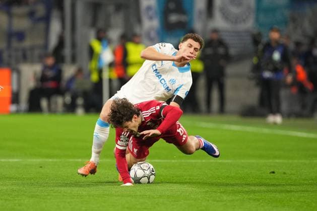 Milos Kerkez of Liverpool is tackled by Benjamin Pavard of Marseille Marseille v Liverpool, UEFA Champions League, Group Stage, Football, Orange Velodrome, Marseille, France - 21 Jan 2026Marseille Orange Vélodrome France EDITORIAL USE ONLY No use with unauthorised audio, video, data, fixture lists, club league logos or live services. Online in-match use limited to 120 images, no video emulation. No use in betting, games or single club league player publications. Copyright: xDavexWinter Shutterstockx 16348361am
