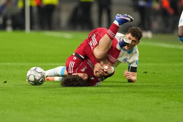 Milos Kerkez of Liverpool is tackled by Benjamin Pavard of Marseille Marseille v Liverpool, UEFA Champions League, Group Stage, Football, Orange Velodrome, Marseille, France - 21 Jan 2026Marseille Orange Vélodrome France EDITORIAL USE ONLY No use with unauthorised audio, video, data, fixture lists, club league logos or live services. Online in-match use limited to 120 images, no video emulation. No use in betting, games or single club league player publications. Copyright: xDavexWinter Shutterstockx 16348361ap