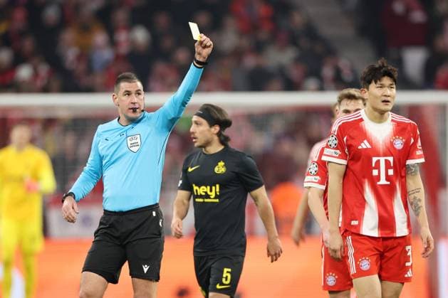 MUNICH - (L-R) Referee Rade Obrenovic gives a yellow card to Minjae Kim of FC Bayern Munich during the Champions League match between FC Bayern Munich and Royale Union Saint-Gilloise on January 21, 2026, at the Allianz Arena in Munich, Germany. BART STOUTJESDIJK ANP UEFA Champions League 2025 26 League Phase MD7 2025-2026 xVIxANPxSportx xBartxStoutjesdijkxIVx 548185608 originalFilename: 548185608.jpg