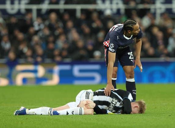 Newcastle Upon Tyne, England, 21st January 2026. Kiliann Sildillia of PSV Eindhoven checks on Lewis Hall of Newcastle United during the Newcastle United vs PSV Eindhoven UEFA Champions League match at St. James Park, Newcastle Upon Tyne. Picture credit should read: Nigel Roddis Sportimage EDITORIAL USE ONLY. No use with unauthorised audio, video, data, fixture lists, club league logos or live services. Online in-match use limited to 120 images, no video emulation. No use in betting, games or single club league player publications. SPI_035_NR_NEWC_PSV SPI-4467-0033