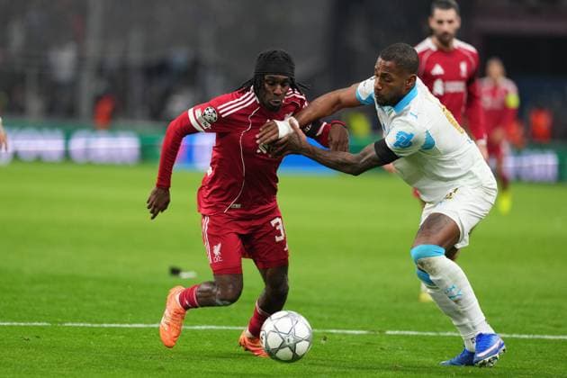 Jeremie Frimpong of Liverpool takes on Geoffrey Kondogbia of Marseille Marseille v Liverpool, UEFA Champions League, Group Stage, Football, Orange Velodrome, Marseille, France - 21 Jan 2026Marseille Orange Vélodrome France EDITORIAL USE ONLY No use with unauthorised audio, video, data, fixture lists, club league logos or live services. Online in-match use limited to 120 images, no video emulation. No use in betting, games or single club league player publications. Copyright: xDavexWinter Shutterstockx 16348361do