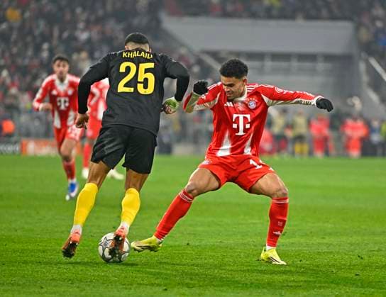 21.01.2026, Fussball UEFA Championsleague 2025 2026: Vorrunde 7.Spieltag, FC Bayern München - Union Saint-Gilloise, in der Allianz-Arena München. v.l. Anan Khalaili (Union Saint-Gilloise) gegen Luis Diaz (FC Bayern München)