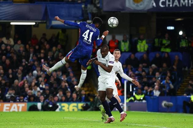 Estevao of Chelsea with a header on goal under pressure from Ken Sema of Pafos Chelsea v Pafos, UEFA Champions League, Group Stage, Football, Stamford Bridge, London, UK - 21 Jan 2026London Stamford Bridge United Kingdom EDITORIAL USE ONLY No use with unauthorised audio, video, data, fixture lists, club league logos or live services. Online in-match use limited to 120 images, no video emulation. No use in betting, games or single club league player publications. Copyright: xSimonxDael Shutterstockx 16348356ba