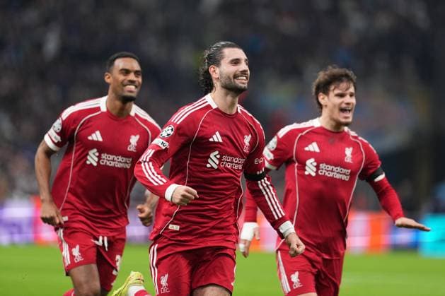 Dominik Szoboszlai of Liverpool celebrates with Ryan Gravenberch of Liverpool and Milos Kerkez of Liverpool after he puts his side 1-0 ahead with a free kick just before half-time Marseille v Liverpool, UEFA Champions League, Group Stage, Football, Orange Velodrome, Marseille, France - 21 Jan 2026Marseille Orange Vélodrome France EDITORIAL USE ONLY No use with unauthorised audio, video, data, fixture lists, club league logos or live services. Online in-match use limited to 120 images, no video emulation. No use in betting, games or single club league player publications. Copyright: xDavexWinter Shutterstockx 16348361le