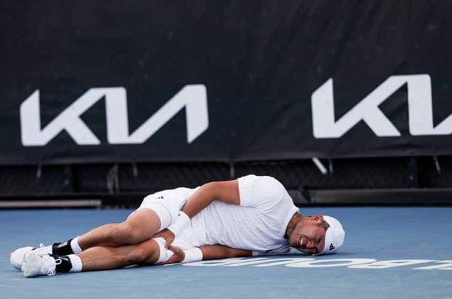 (260122) -- MELBOURNE, Jan. 22, 2026 -- Wu Yibing reacts as he lies on the court during the men s singles 2nd round match between Wu Yibing of China and Eliot Spizzirri of the United States at the Australian Open tennis tournament in Melbourne, Australia, Jan. 22, 2026. ) (SP)AUSTRALIA-MELBOURNE-TENNIS-AUSTRALIAN OPEN-MEN S SINGLES MaxPing 