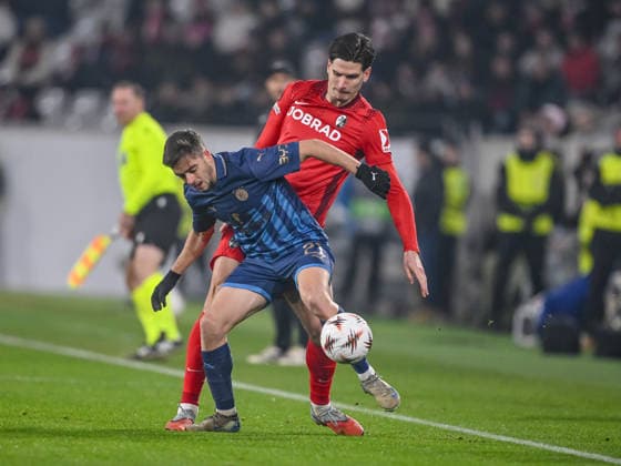Noam Ben Harosh (Maccabi Tel-Aviv FC) und Igor MatanoviÄ‡ (SC Freiburg) battle for the ball during the UEFA Europa League 2025 26 League Phase MD7 match between SC Freiburg and Maccabi Tel-Aviv FC at Stadion am Wolfswinkel on January 22, 2026 in Freiburg im Breisgau, Germany. (Photo by Harry Langer DeFodi Images) -