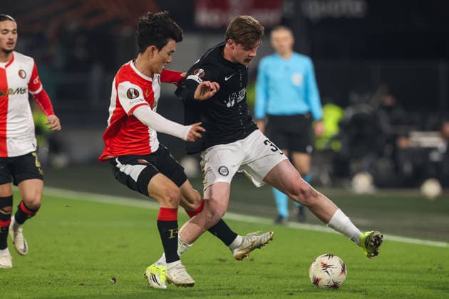 2026-01-22 Feyenoord v SK Sturm Graz - UEFA Europa League, League phase, MD7 ROTTERDAM, NETHERLANDS - JANUARY 22: Luca Weinhandl of SK Sturm Graz battles for the ball with Inbeom Hwang of Feyenoord during the UEFA Europa League, League phase, MD7 match between Feyenoord and SK Sturm Graz at Stadion Feijenoord on January 22, 2026 in Rotterdam, Netherlands. Rotterdam Stadion Feijenoord Netherlands Content not available for redistribution in The Netherlands directly or indirectly through any third parties. Copyright: xHansxvanxderxValkx