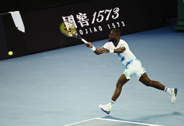 (260123) -- MELBOURNE, Jan. 23, 2026 -- Frances Tiafoe hits a return during the men s singles 3rd round match between Alex de Minaur of Australia and Frances Tiafoe of the United States at the Australian Open tennis tournament in Melbourne, Australia, Jan. 23, 2026. (Photo by Xinhua) (SP)AUSTRALIA-MELBOURNE-TENNIS-AUSTRALIAN OPEN-MEN S SINGLES WangxShen 