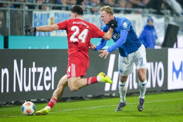 Fussball: 2. Bundesliga, 19. Spieltag, SV Darmstadt 98 - 1. FC Nürnberg am 23.01.2026 in Darmstadt (Merck-Stadion am Böllenfalltor), Deutschland, Saison 2025 2026: DFB DFL REGULATIONS PROHIBIT ANY USE OF PHOTOGRAPHS as IMAGE SEQUENCES and or QUASI-VIDEO: Luka Lochoshvili (24, FCN) im Zweikampf mit Isac Alexi Sivert Lidberg (7, SVD). Darmstadt Merck-Stadion am Böllenfalltor Deutschland