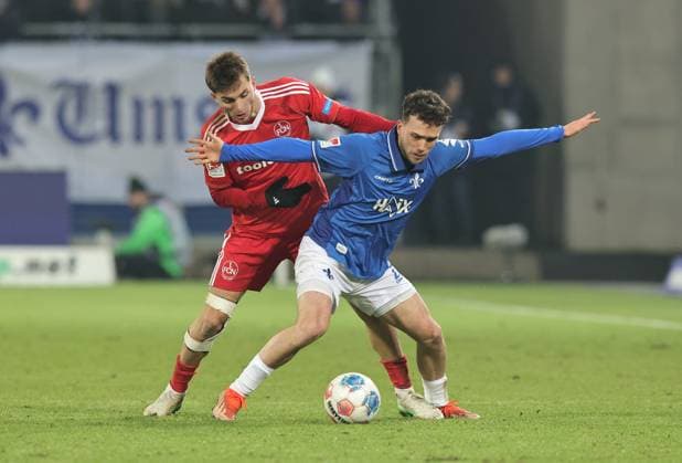 23.01.2026 - Fussball - Saison 2025 2026 - 2. Fussball - Bundesliga - 19. Spieltag: SV Darmstadt 98 SVD D98 ( Lilien ) - 1. FC Nürnberg FCN ( Club ) - Sportfoto Zink DaMa - xdaxmax - DFL regulations prohibit any use of photographs as image sequences and or quasi-video - only for editorial use - Adam Markhiev (6, 1. FC Nürnberg FCN ) Sergio Lopez (2, SV Darmstadt 98 D98 SV98 )