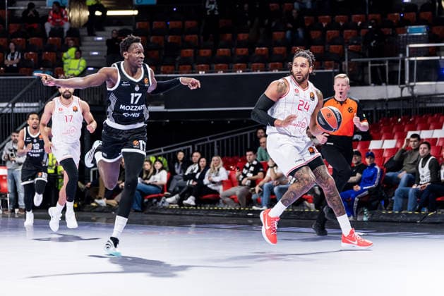 MUNICH, GERMANY - JANUARY 23: Ish Wainright (Hapoel IBI Tel Aviv, 24) controls the ball against Isaac Bonga (Partizan Mozzart Bet Belgrade, 17) during the Turkish Airlines EuroLeague match between Partizan Mozzart Bet Belgrade vs. Hapoel IBI Tel Aviv at BMW Park on round 24 of Turkish Airlines EuroLeague on January 23, 2026 in Munich, Germany. Bavaria Germany Copyright: xSteffiexWunderlx