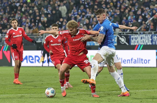 23.01.2026 - Fussball - Saison 2025 2026 - 2. Fussball - Bundesliga - 19. Spieltag: SV Darmstadt 98 SVD D98 ( Lilien ) - 1. FC Nürnberg FCN ( Club ) - Sportfoto Zink DaMa - xdaxmax - DFL regulations prohibit any use of photographs as image sequences and or quasi-video - only for editorial use - Piet Scobel (39, 1. FC Nürnberg FCN ) Matej Maglica (5, SV Darmstadt 98 D98 SV98 )