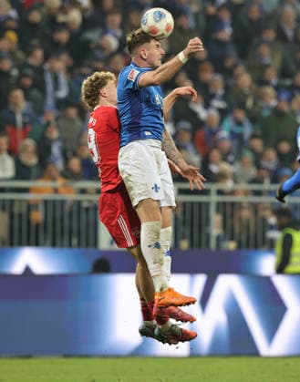 23.01.2026 - Fussball - Saison 2025 2026 - 2. Fussball - Bundesliga - 19. Spieltag: SV Darmstadt 98 SVD D98 ( Lilien ) - 1. FC Nürnberg FCN ( Club ) - Sportfoto Zink DaMa - xdaxmax - DFL regulations prohibit any use of photographs as image sequences and or quasi-video - only for editorial use - Piet Scobel (39, 1. FC Nürnberg FCN ) Matej Maglica (5, SV Darmstadt 98 D98 SV98 )
