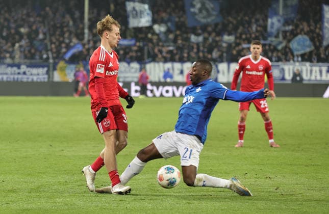 23.01.2026 - Fussball - Saison 2025 2026 - 2. Fussball - Bundesliga - 19. Spieltag: SV Darmstadt 98 SVD D98 ( Lilien ) - 1. FC Nürnberg FCN ( Club ) - Sportfoto Zink DaMa - xdaxmax - DFL regulations prohibit any use of photographs as image sequences and or quasi-video - only for editorial use - Tim Janisch (32, 1. FC Nürnberg FCN ) Matondo Merveille Papela (21, SV Darmstadt 98 D98 SV98 )