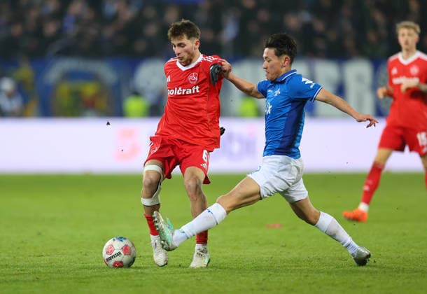 23.01.2026, Fussball 2. Bundesliga, SV Darmstadt 98 - 1. FC Nürnberg, emonline, emspor, despor, v.l., Adam Markhiev (1. FC Nürnberg), Hiroki Akiyama (SV Darmstadt 98) DFL DFB REGULATIONS PROHIBIT ANY USE OF PHOTOGRAPHS AS IMAGE SEQUENCES AND OR QUASI-VIDEO. xdcx