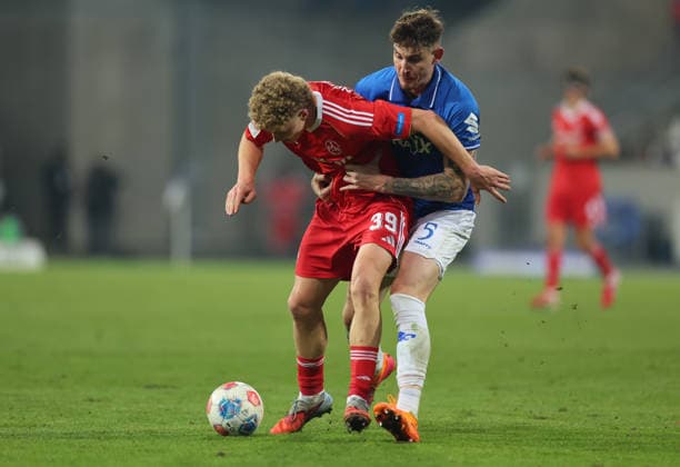 23.01.2026, Fussball 2. Bundesliga, SV Darmstadt 98 - 1. FC Nürnberg, emonline, emspor, despor, v.l., Piet Scobel (1. FC Nürnberg), Matej Maglica (SV Darmstadt 98) DFL DFB REGULATIONS PROHIBIT ANY USE OF PHOTOGRAPHS AS IMAGE SEQUENCES AND OR QUASI-VIDEO. xdcx